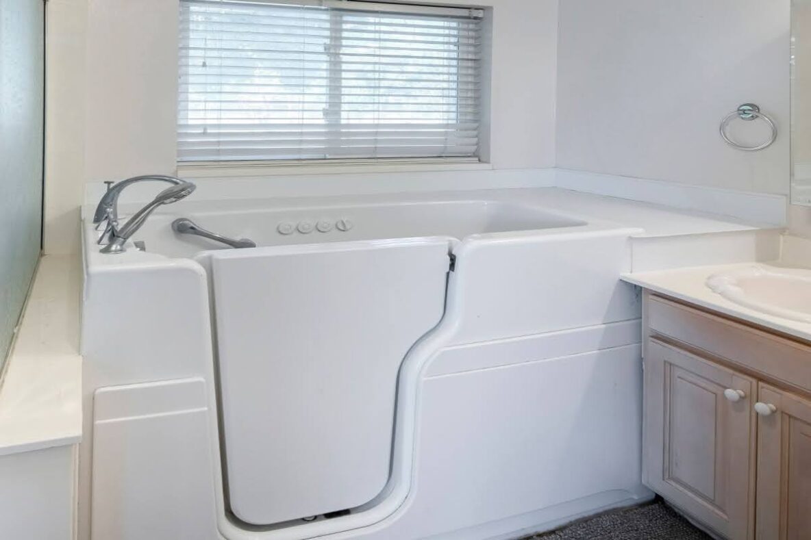 walk-in bathtub in a bathroom designed for seniors